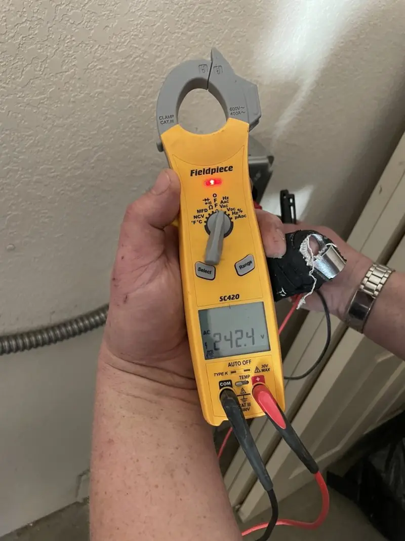 Voltage testing with clamp meter during Generator Installation in Sarasota